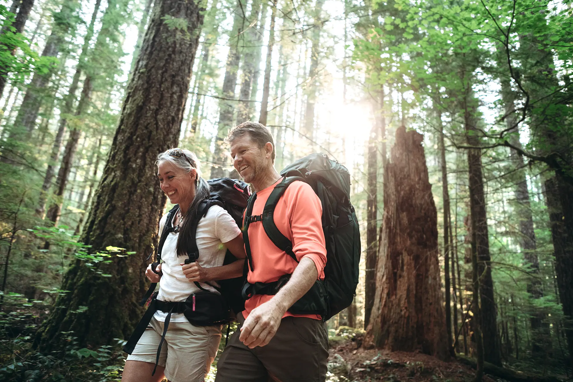 Elderly Mom hiking with adult son